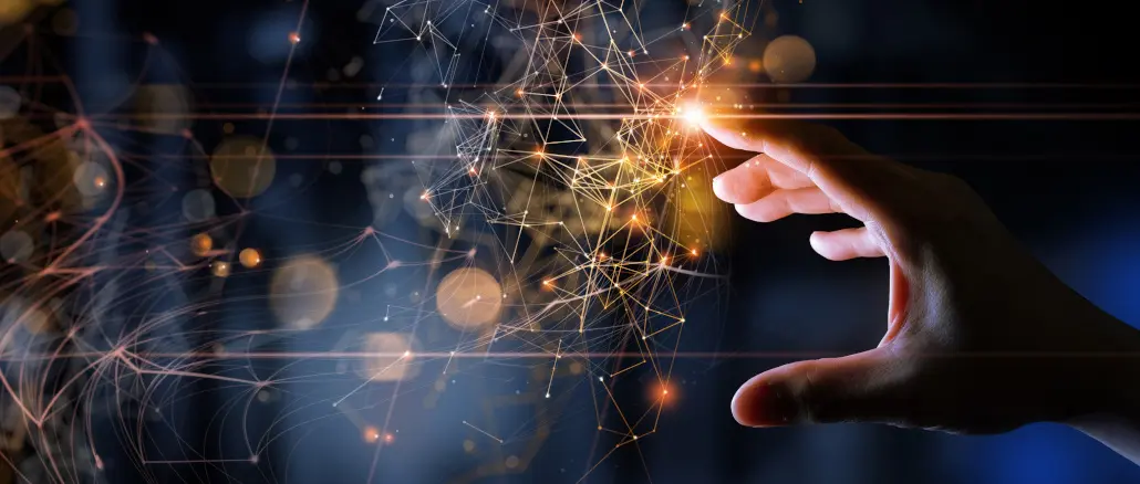 Eine Hand berührt einen beleuchteten Touchscreen mit vielen Datenpunkten
